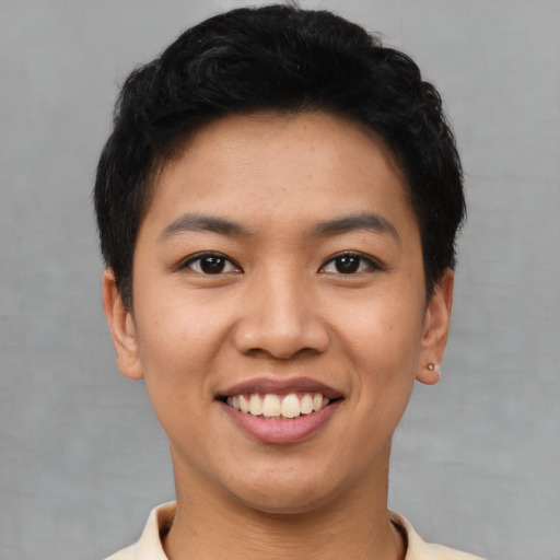 Joyful asian young-adult female with short  black hair and brown eyes