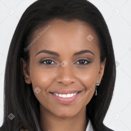 Joyful black young-adult female with long  brown hair and brown eyes