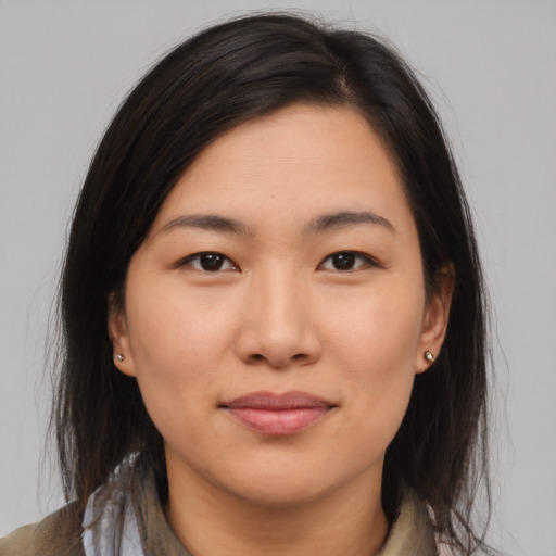 Joyful asian young-adult female with medium  brown hair and brown eyes