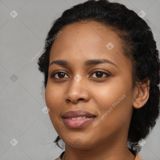 Joyful black young-adult female with medium  black hair and brown eyes