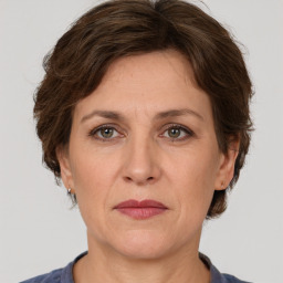 Joyful white adult female with short  brown hair and brown eyes