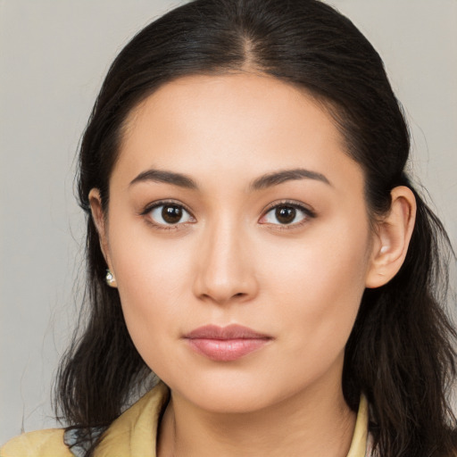 Neutral white young-adult female with long  brown hair and brown eyes