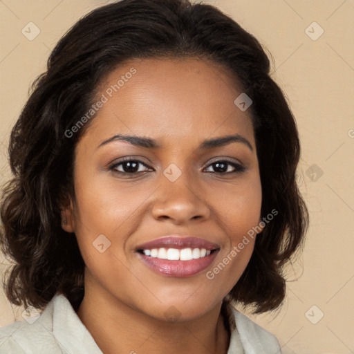 Joyful black young-adult female with long  brown hair and brown eyes