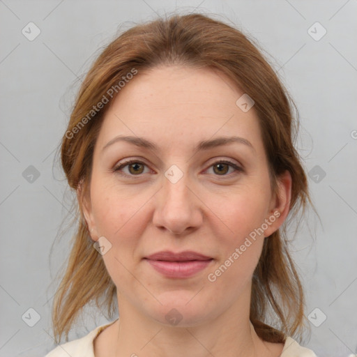 Joyful white adult female with medium  brown hair and grey eyes