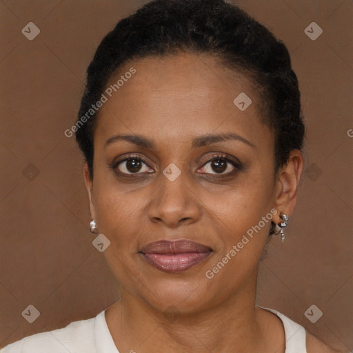 Joyful black adult female with short  brown hair and brown eyes