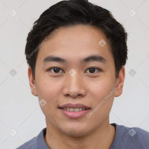 Joyful white young-adult male with short  black hair and brown eyes