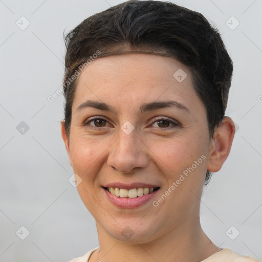 Joyful white young-adult female with short  brown hair and brown eyes