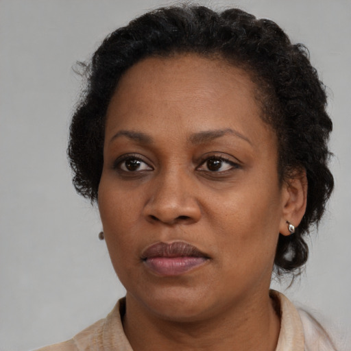 Neutral black adult female with short  brown hair and brown eyes