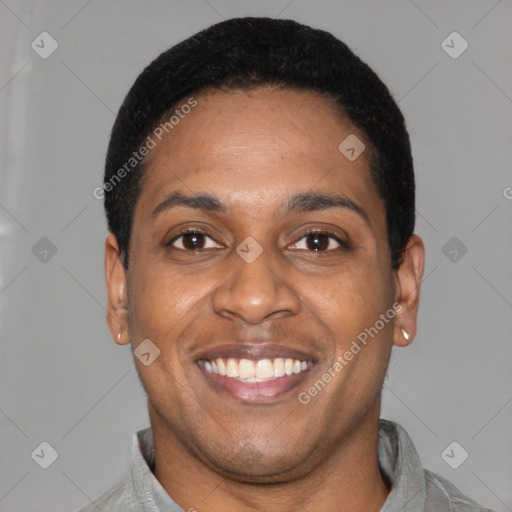 Joyful latino young-adult male with short  black hair and brown eyes