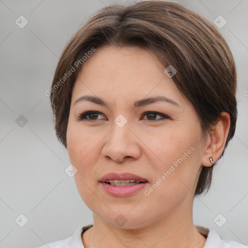 Joyful white adult female with medium  brown hair and brown eyes