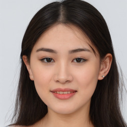 Joyful asian young-adult female with long  brown hair and brown eyes