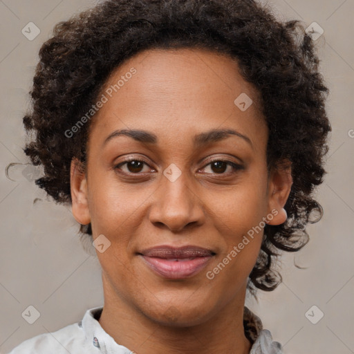 Joyful black adult female with short  brown hair and brown eyes