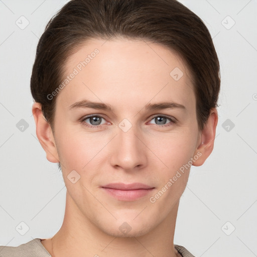 Joyful white young-adult female with short  brown hair and grey eyes