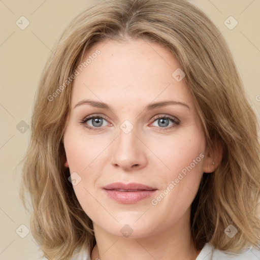 Joyful white young-adult female with medium  brown hair and green eyes