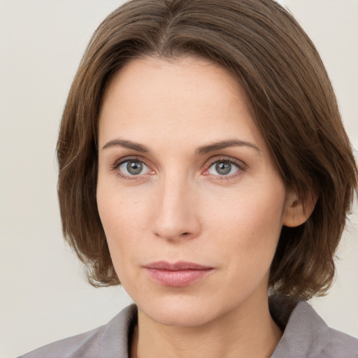 Neutral white young-adult female with medium  brown hair and grey eyes