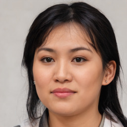 Joyful asian young-adult female with medium  black hair and brown eyes