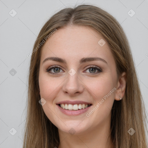 Joyful white young-adult female with long  brown hair and grey eyes