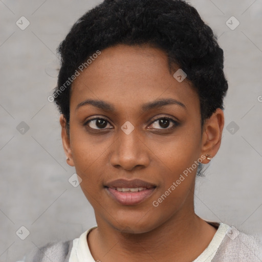 Joyful black young-adult female with short  black hair and brown eyes