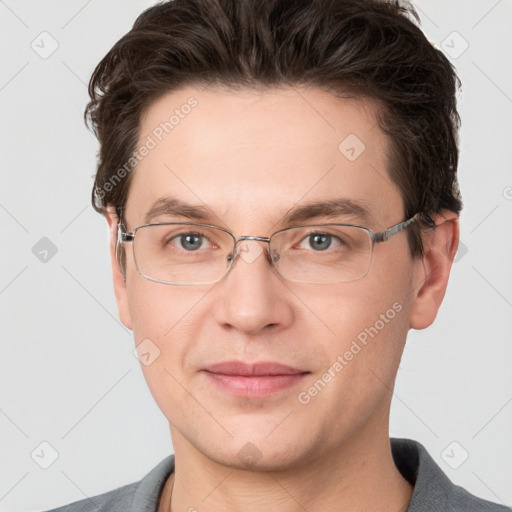 Joyful white adult male with short  brown hair and grey eyes