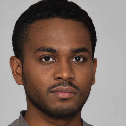 Neutral black young-adult male with short  brown hair and brown eyes