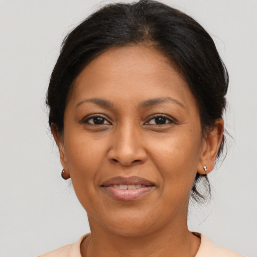Joyful asian adult female with medium  brown hair and brown eyes