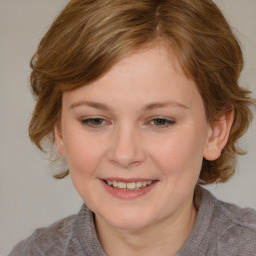 Joyful white young-adult female with medium  brown hair and blue eyes