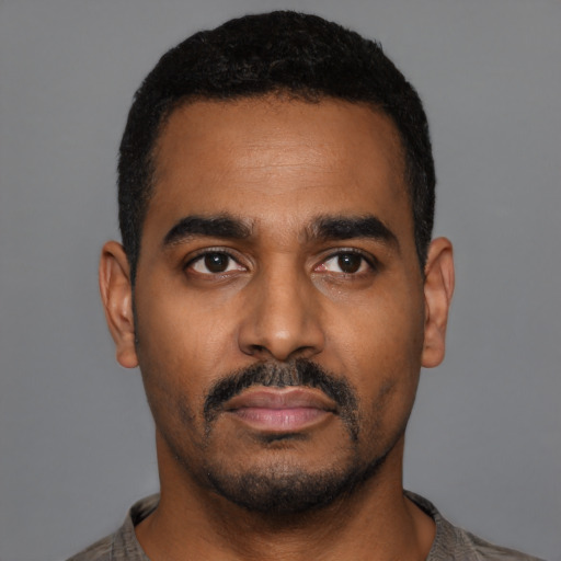 Neutral black young-adult male with short  black hair and brown eyes