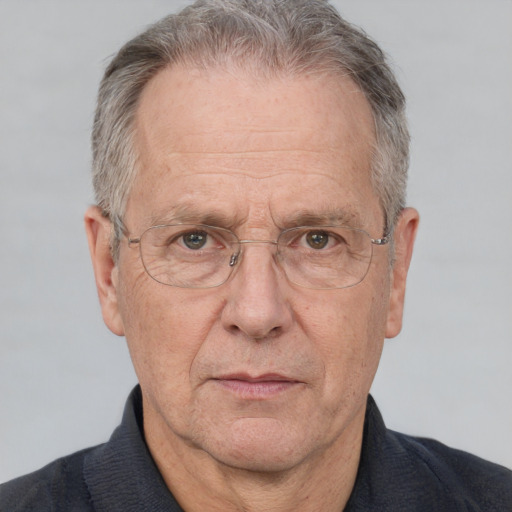 Neutral white middle-aged male with short  gray hair and brown eyes