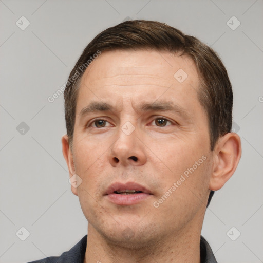 Neutral white adult male with short  brown hair and brown eyes