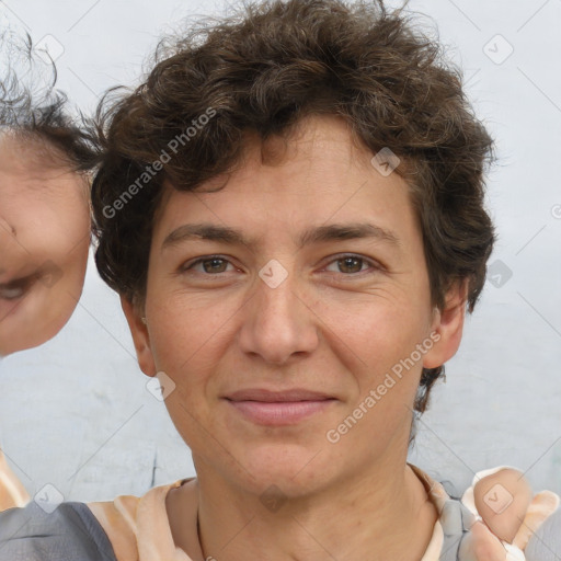 Joyful white adult female with short  brown hair and brown eyes