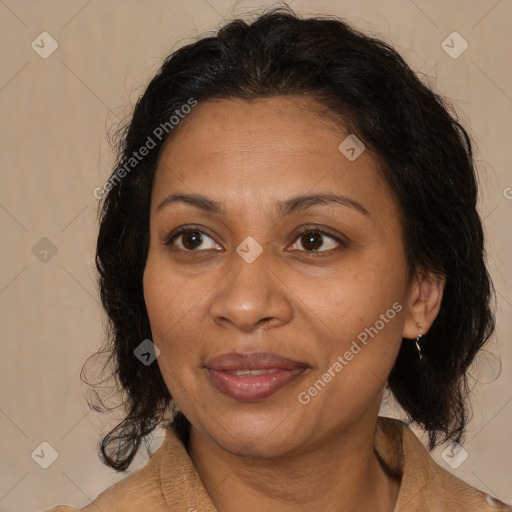 Joyful black adult female with medium  brown hair and brown eyes