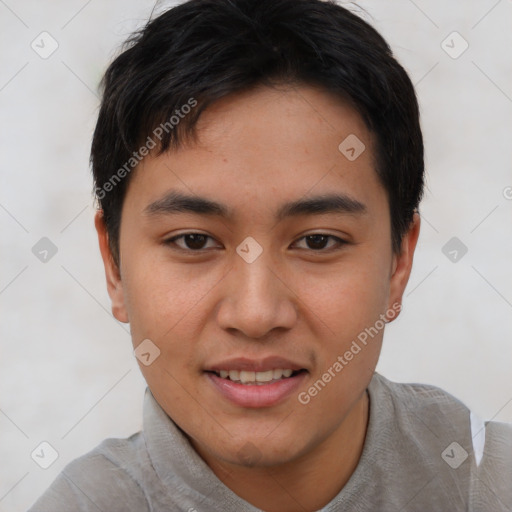 Joyful asian young-adult male with short  black hair and brown eyes