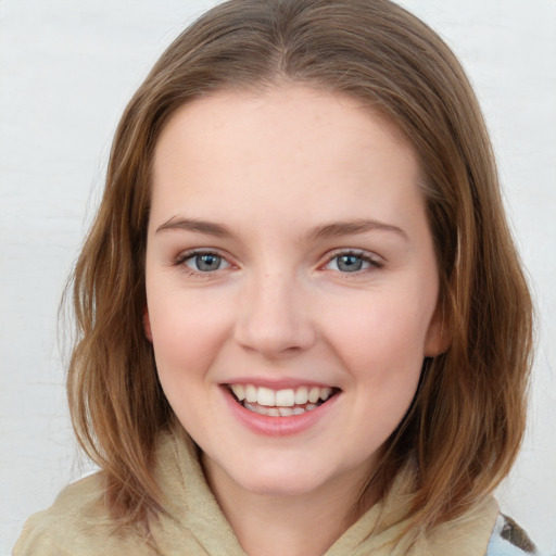 Joyful white young-adult female with medium  brown hair and blue eyes