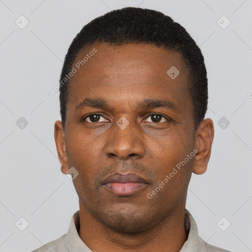 Neutral black young-adult male with short  black hair and brown eyes