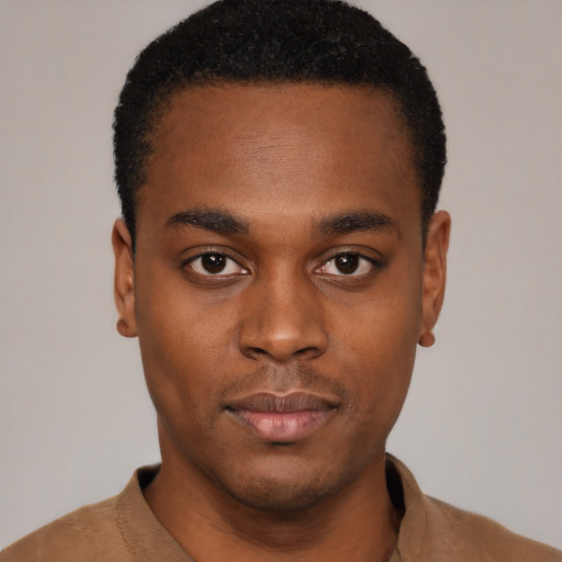 Neutral black young-adult male with short  black hair and brown eyes