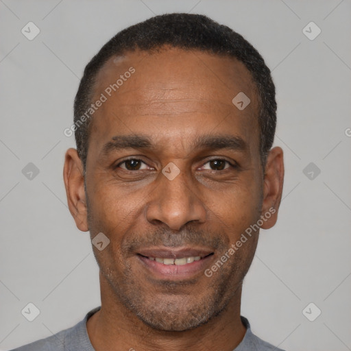 Joyful latino adult male with short  black hair and brown eyes