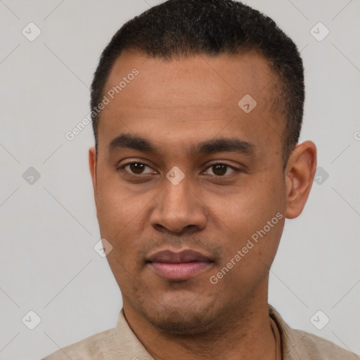 Joyful latino young-adult male with short  black hair and brown eyes