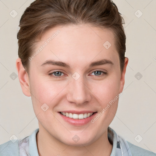 Joyful white young-adult female with short  brown hair and grey eyes