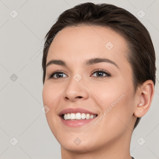 Joyful white young-adult female with short  brown hair and brown eyes