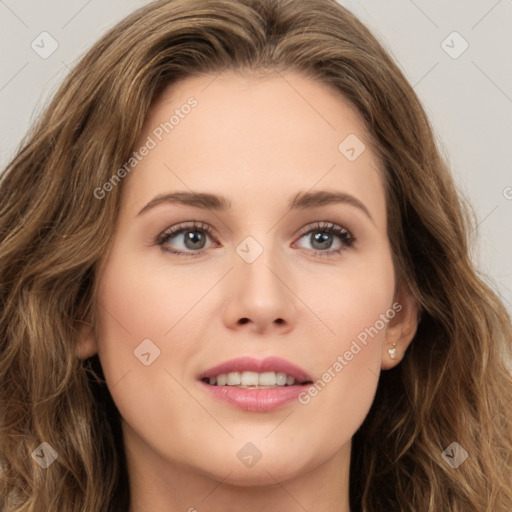 Joyful white young-adult female with long  brown hair and green eyes