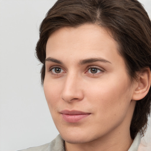 Neutral white young-adult female with medium  brown hair and brown eyes