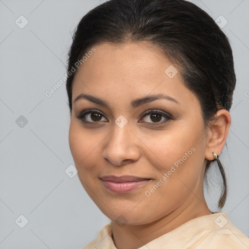 Joyful latino young-adult female with medium  brown hair and brown eyes