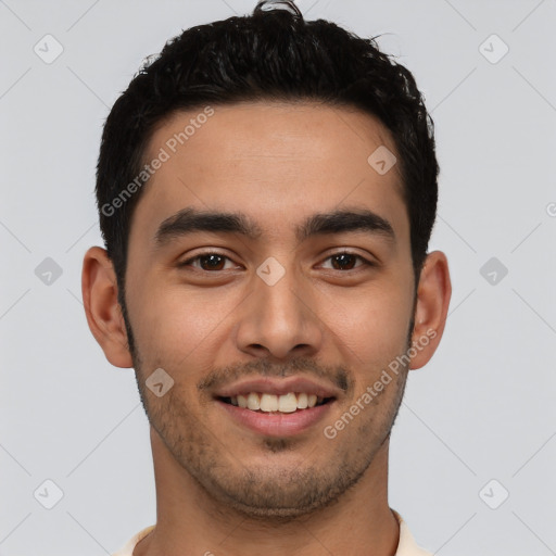 Joyful latino young-adult male with short  brown hair and brown eyes