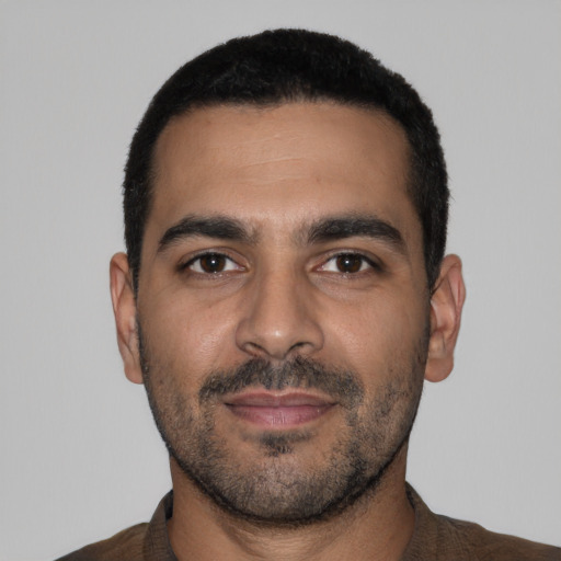 Neutral latino young-adult male with short  black hair and brown eyes