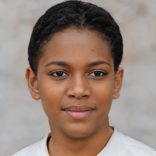 Joyful black child female with short  brown hair and brown eyes