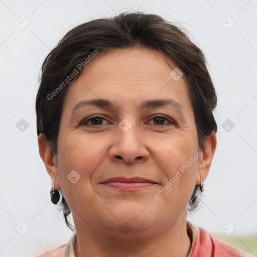 Joyful white adult female with short  brown hair and brown eyes