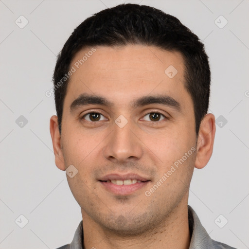 Joyful white young-adult male with short  black hair and brown eyes