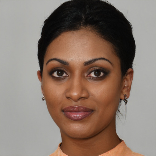 Joyful asian young-adult female with short  black hair and brown eyes
