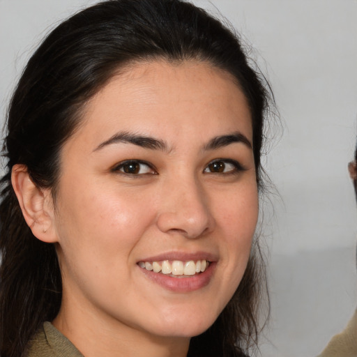Joyful white young-adult female with medium  brown hair and brown eyes