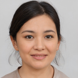 Joyful asian young-adult female with medium  brown hair and brown eyes